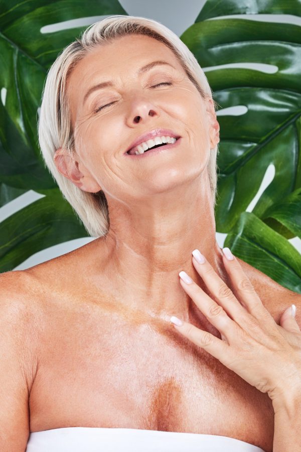 Beauty, skincare and senior woman in a studio with an anti aging, natural and organic face routine