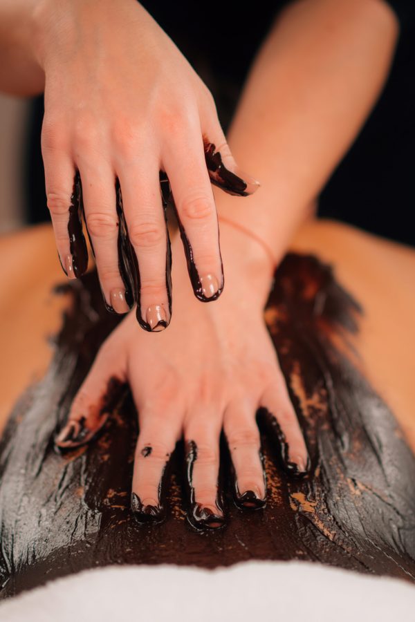 Chocolate Body Massage. Beauty Treatment with rich, cocoa Paste.