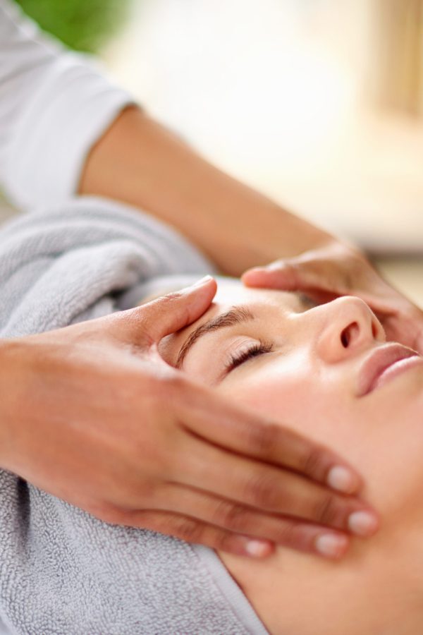 Cropped shot of a young woman enjyoing a massage at the day spa.