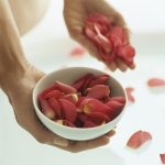 Woman holding rose petals