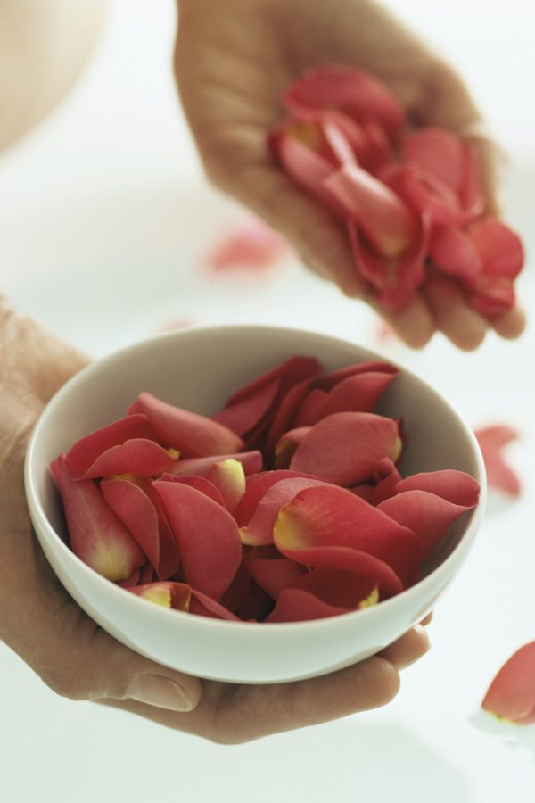Woman holding rose petals